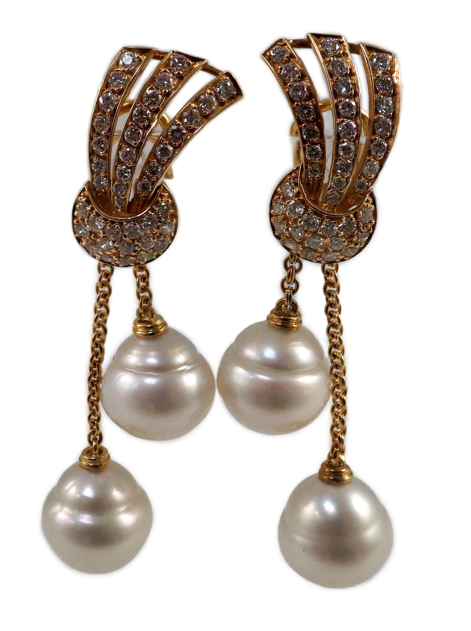 A modern pair of gold (tests as 18ct) and two stone South Sea pearl and diamond cluster set double drop earrings